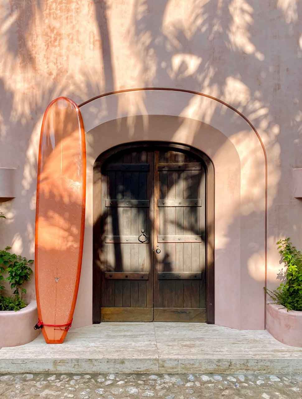 Image of surfboard by front door